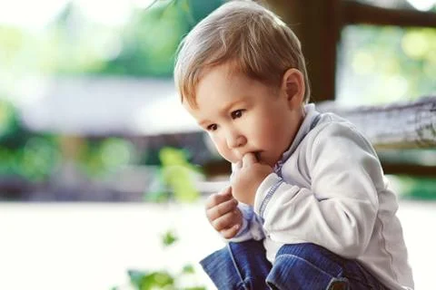 Boy thinking at the park Stock Photos