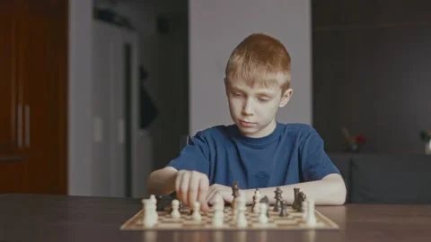 The boy thinks about the move Stock Footage 233928271
