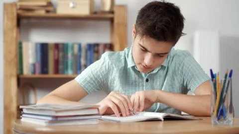 Boy thinks and does the lessons Stock Photos