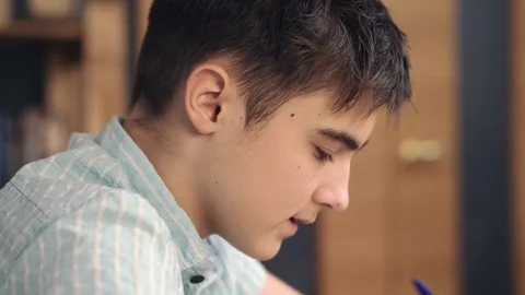 Boy thinks on a dark background Stock Footage 72126927