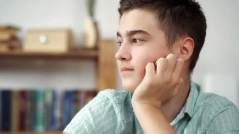 Boy thinks on a white background Stock Photos
