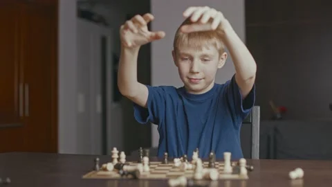 Boy throwing chess pieces Stock Footage 233928011