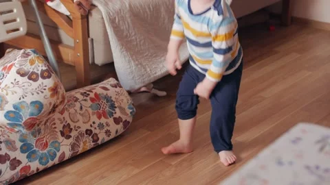 Boy Throwing Pillows Stock Footage 151803068