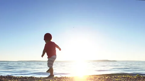 Boy throwing rocks. Stock Footage 64727187
