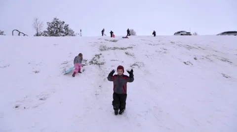 Boy throwing snowballs at camera Stock Footage 45021275