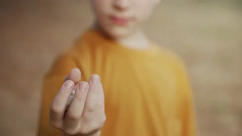 Boy throwing a stone into the water Video stock 203873763