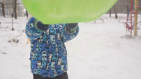 Boy throws snow at the camera on winter background. Stock Footage 85298534