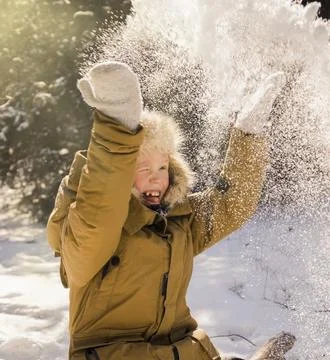 The boy throws snow Stock Photos