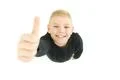 The boy thumbs up to the camera. View from above Photo