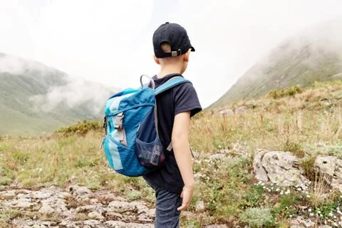 Boy on top of the mountain Stock Photos