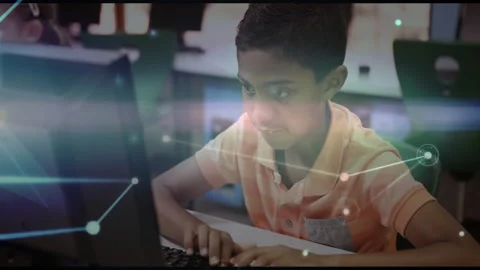 Boy touching keyboard and typing in lab, initiating animated network graphic Stock Footage 312380822