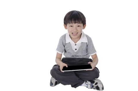 Boy with a touchpad Stock Photos