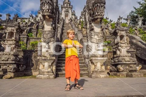 Boy tourist on background of Three stone ladders in beautiful Pura Lempuyang Stock Photos