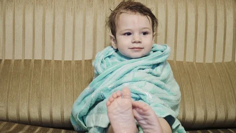 Boy in the towel is shaking Stock Footage 129681633