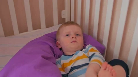 Boy With Toy In Bed Stock Footage 151803109