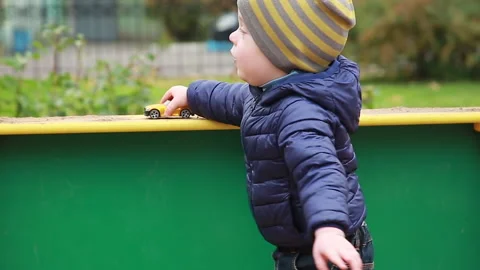 A boy with a toy car Stock Footage 162852462