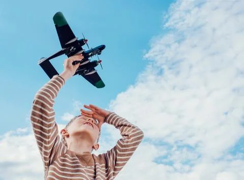 Boy with toy plane Stock Photos