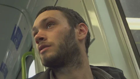 Boy on train talking with passenger Stockbeeldmateriaal 69740072
