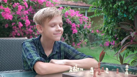 Boy is training the chess in the cafe Stock-Footage 157629157