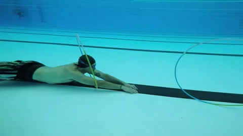 Boy training with hoops in the pool Video stock 196807768