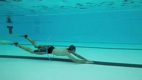 Boy training with hoops in the pool Video stock 196807787