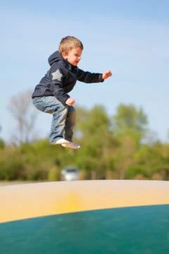 Boy trampoline jumping Stock Photos