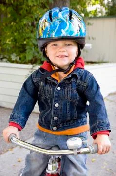 Boy on tricycle Stock Photos