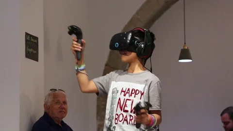 Boy Tries Virtual Reality HTC Vive Stock Footage 74289679