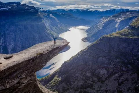 Boy on Trolltunga in norway 写真素材