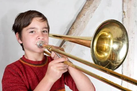 Boy with a trombone Stock-Fotos