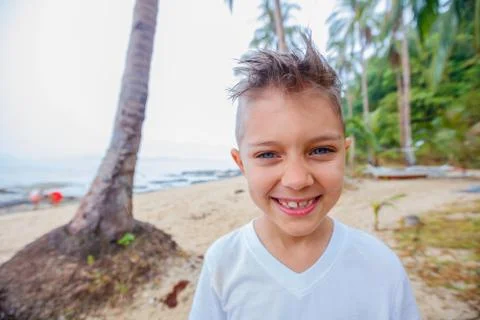 Boy on tropical beach 写真素材