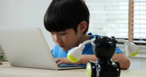 Boy try to test robots in school science club. Stock Footage 108621111