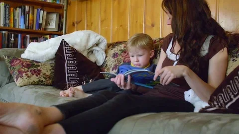 Boy trying to listen mom Stock Footage 80621526