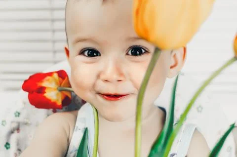 The boy with tulips Stock Photos