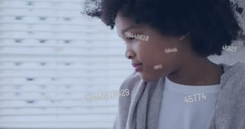 Boy turning left while numeric overlay appearing, drifting across face and Stock Footage 330238166