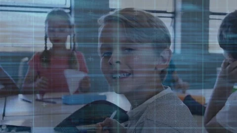 Boy turning toward teacher cue, holding pencil and smiling, code overlay Stock Footage 330192120