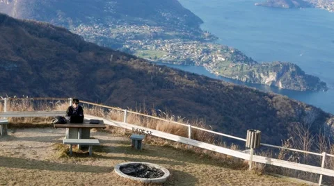 Boy turns off the computer after working in a rest area in the mountains Stock Footage 59527742
