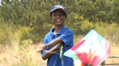 Boy twirling a kite. Stock-Footage 27738202