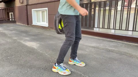 The boy twists the school backpack around him Stock Footage 161028470