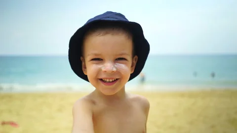 Boy of two years shows a thumbs up to the camera. Stock Footage 88476644