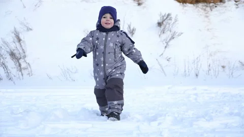 Boy of two years walks in winter. Stock Footage 85672502