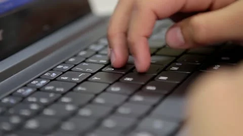 Boy typing computer Vídeos de archivo 12421978
