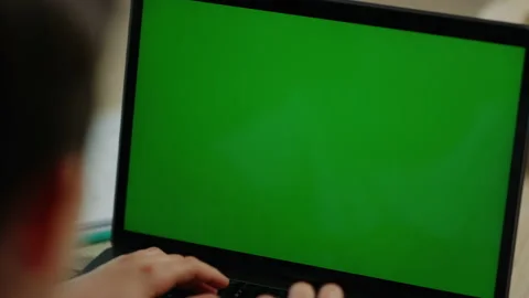 Boy typing on computer at home. Schoolboy looking laptop screen inside. Stock Footage 142932544