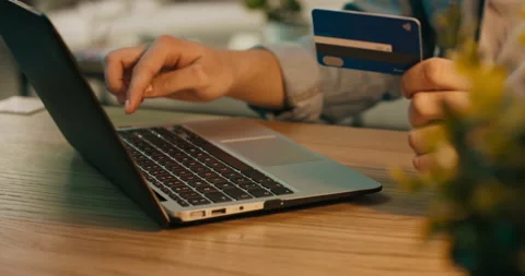 A boy is typing credit card information into his phone sitting alone in his room Stock Footage 218242531