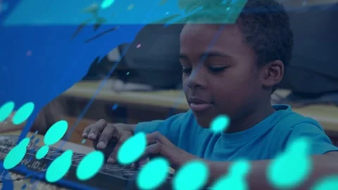 Boy typing at keyboard in school lab, teal data overlay appearing and Stock Footage 332469216