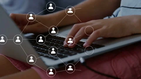 Boy typing on laptop, causing network nodes emerging and linking across hands, Stock Footage 334013963