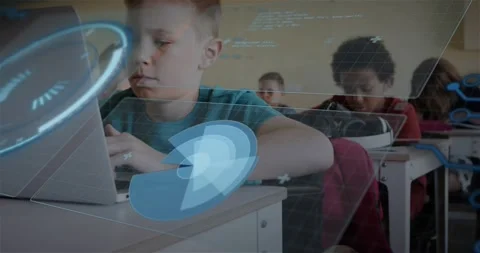 Boy typing on laptop in classroom, activating circular HUD graphics depicting Stock Footage 317369832
