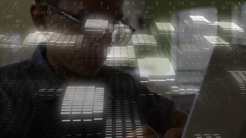 Boy typing on laptop at desk, typing initiating binary overlay reflecting on Stock Footage 334178850