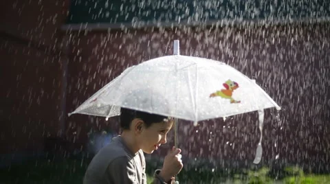 Boy with an umbrella, it is raining Video stock 881256