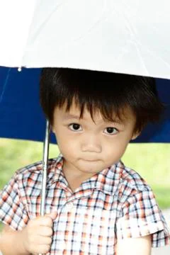 Boy with umbrella Foto stock